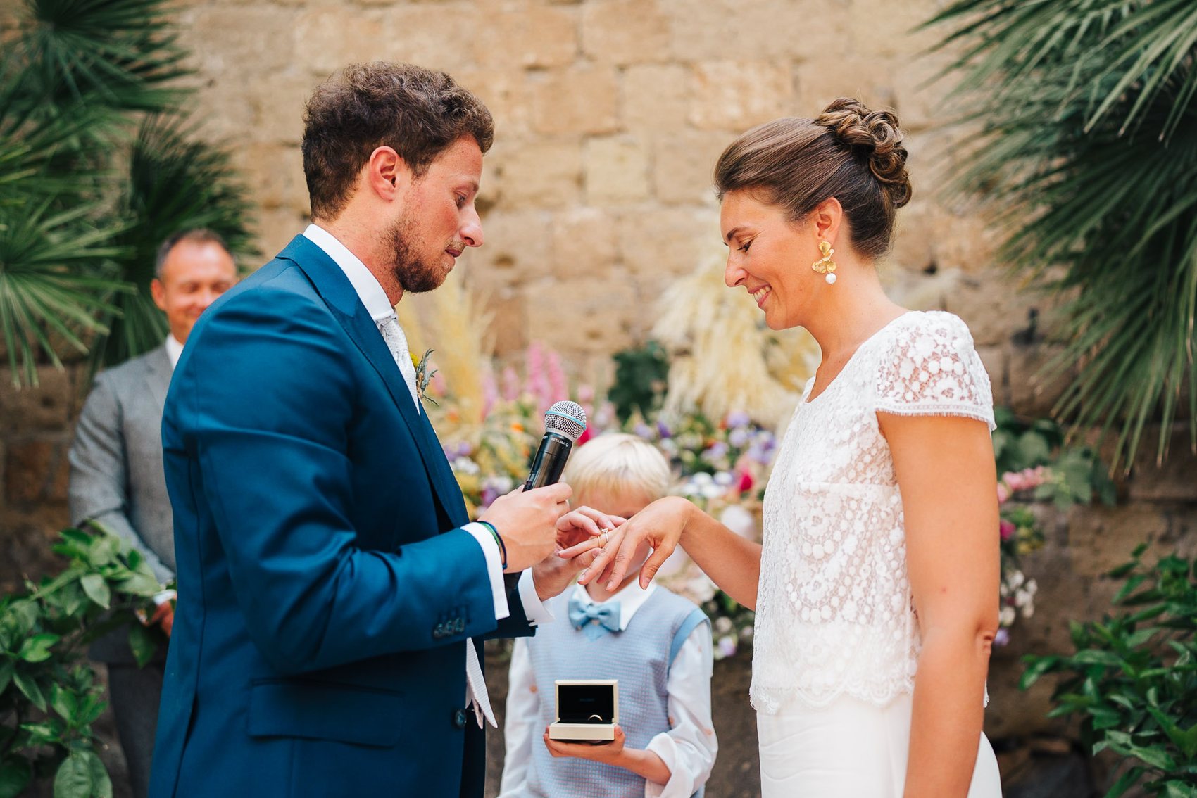 Bride and groom laughing during an Italian wedding ceremony