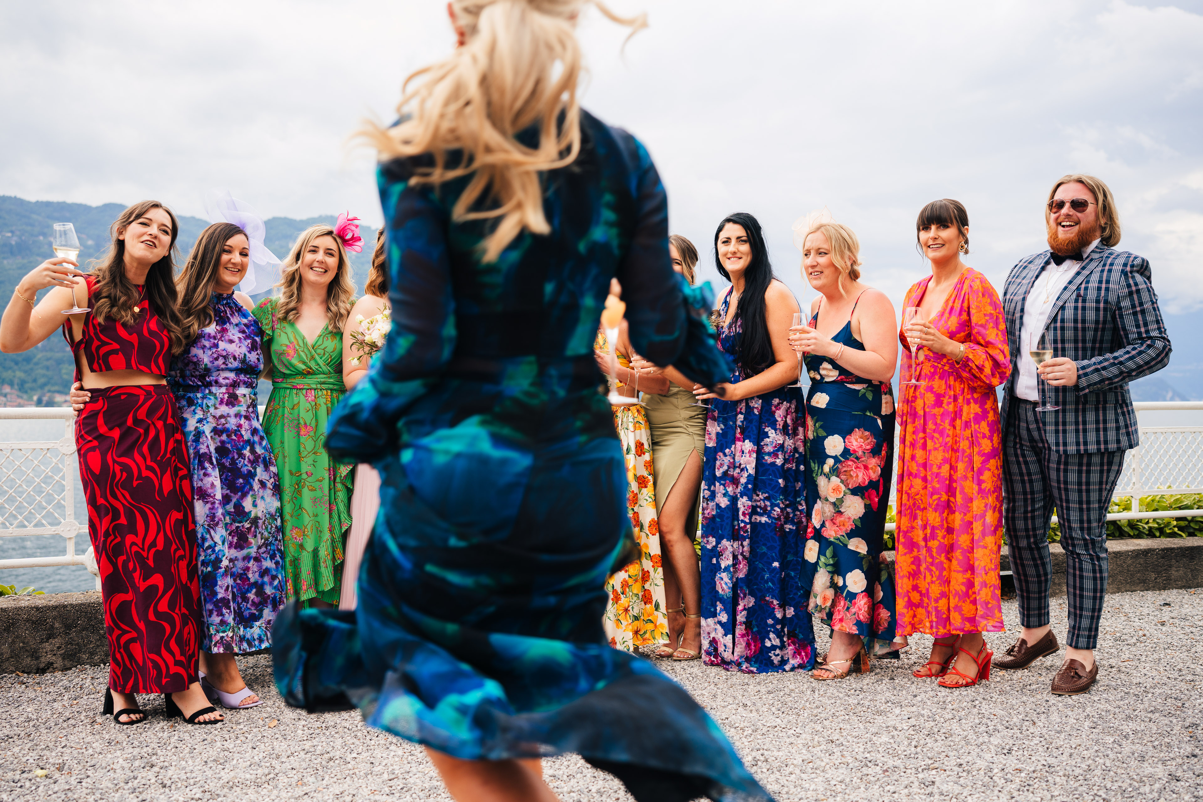 Wedding guests gathered by the water