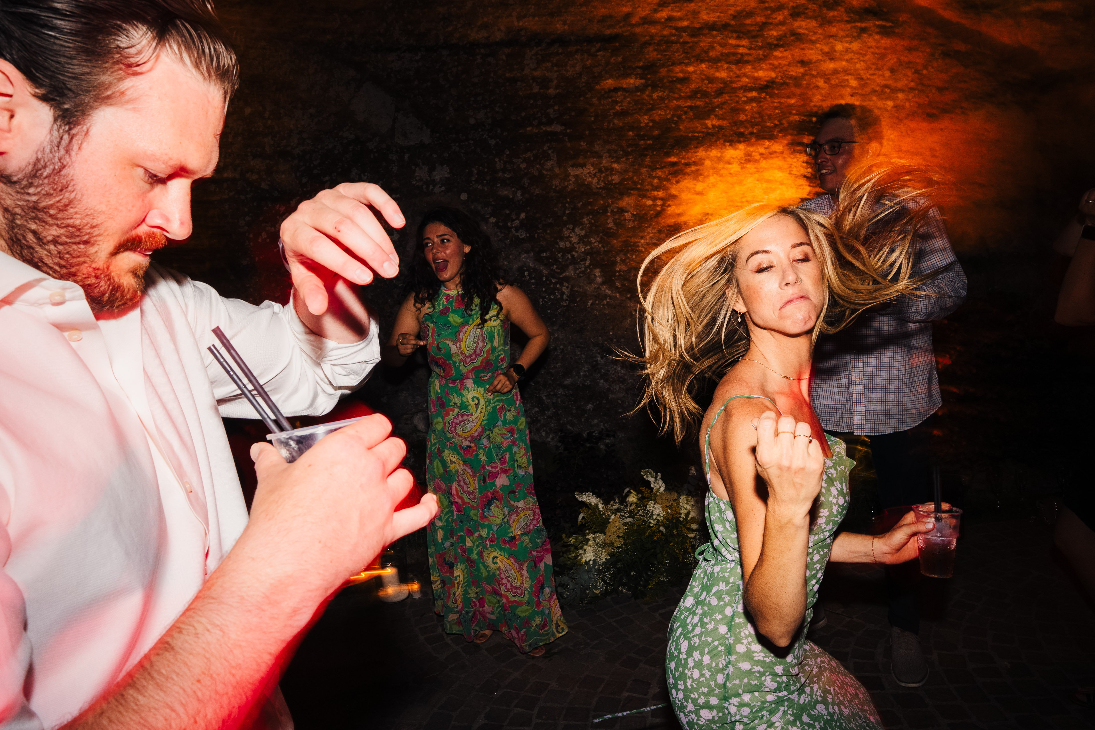 Wedding guests dancing at night